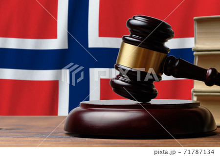 Justice and court concept in Kingdom of Norway. Judge hammer on a flag background 71787134