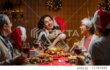 family celebrating Christmas 71787899