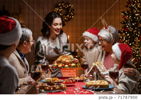 family celebrating Christmas 71787900