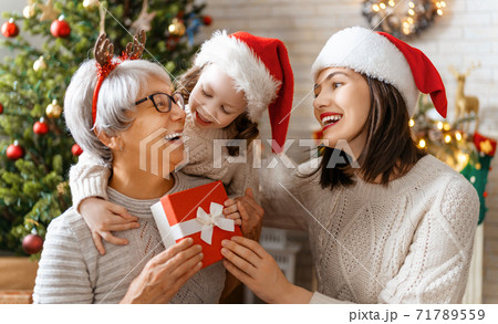 family celebrating Christmas 71789559