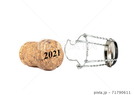 Separated champagne cork and muselet isolated on white background. Separated champagne cork and muselet isolated on white background. 71790611