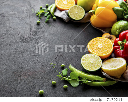 Healthy food. Vegetables and fruits on a black concrete background. Healthy food. Vegetables and fruits on a black concrete background. 71792114
