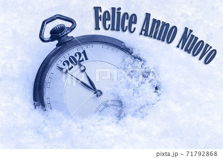 New year 2021, Happy New Year 2021 greeting in Italian language, Felice Anno Nuovo text, countdown to midnight 71792868