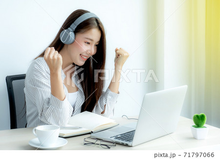 Young Asian teachers are teaching fun online from their home office, social distancing teaching concept during COVID virus diseases 71797066