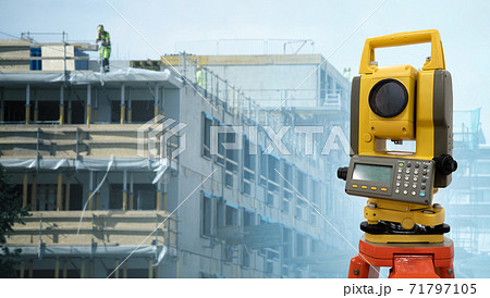 Theodolite on a background of construction site 71797105