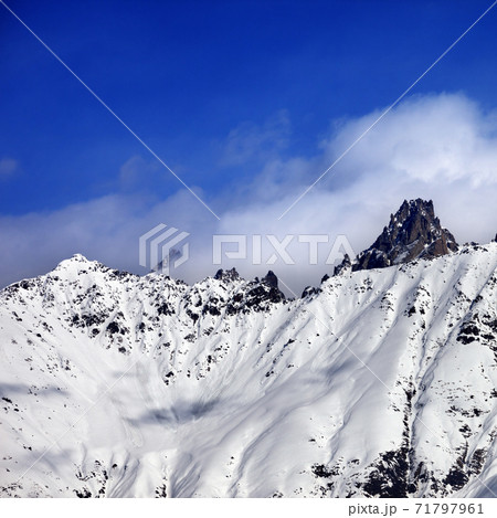 Snow avalanches mountainside in clouds Snow avalanches mountainside in clouds 71797961