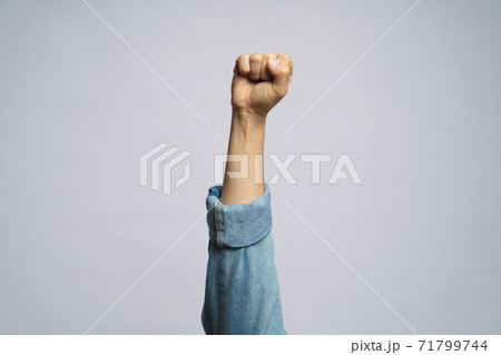 Human hand showing fist isolated over white background. Human hand showing fist isolated over white background. 71799744