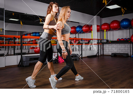 Young sporty girl with her dance teacher in studio Young sporty girl with her dance teacher in studio 71800165
