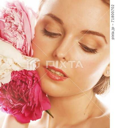 young beauty woman with flower peony pink closeup makeup soft tender gentle look 71800702