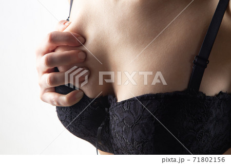 Young girl with hands on black bra Young girl with hands on black bra 71802156