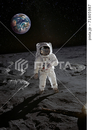 Astronaut on the moon surface with planet Earth behind 71805987