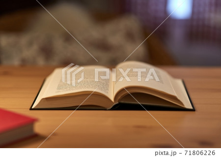 Book in a table in a room 71806226