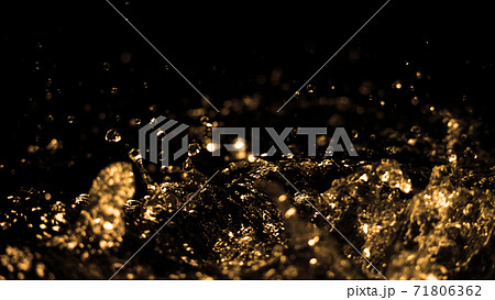 Hi speed close up images of oil liquid from diesel gasoline splashing and moving up to the air on black background for represent power of fuel liquid that active and powerful. Hi speed close up images of oil liquid from diesel gasoline splashing and moving up to the air on black background for represent power of fuel liquid that active and powerful. 71806362