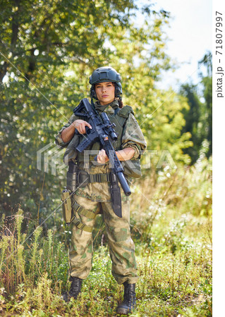 powerful sportive woman soldier ready for battle wearing protective military gear powerful sportive woman soldier ready for battle wearing protective military gear 71807997