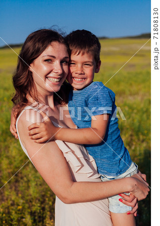 Mom holds her son's family love summer Mom holds her son's family love summer 71808130