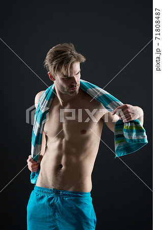Man wipe with towel after training. Sportsman with fit bare 71808487