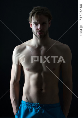 Athlete with fit body in shorts. Sportsman with sexy torso  71808488