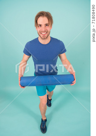 Pilates. Happy sportsman smile with yoga mat. Fashion  71808490