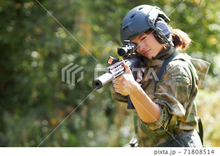 sportive woman soldier shooting with rifle machine gun in the forest sportive woman soldier shooting with rifle machine gun in the forest 71808514