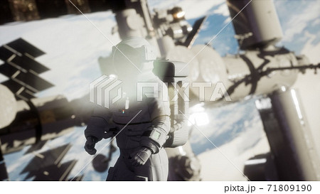 8K Astronaut outside the International Space Station on a spacewalk 71809190