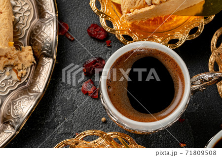 Cup of coffee and turkish pastries on dark surface 71809508