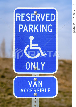 Blue Reserved Parking Van Accessible sign with a man on a wheelchair icon Blue Reserved Parking Van Accessible sign with a man on a wheelchair icon 71812893