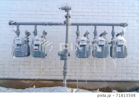 Water meters and pipes covered with ice during winter in Eagle Mountain 71813508