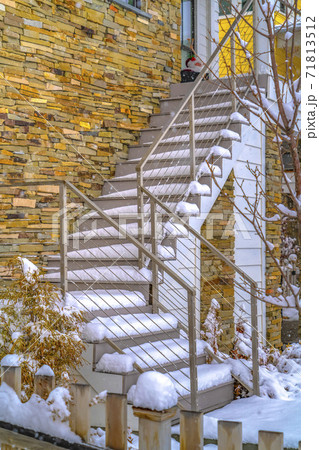 Snowy outdoor stairs of home in Daybreak Utah 71813512