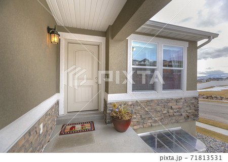 White front door and reflective window of a home against road and cloudy sky White front door and reflective window of a home against road and cloudy sky 71813531