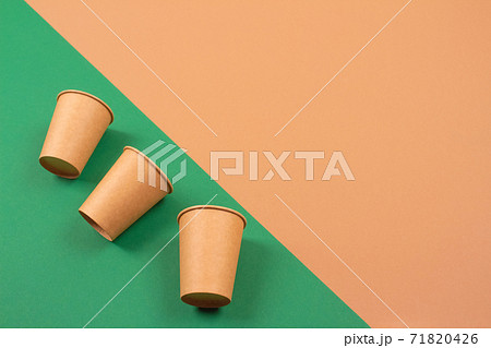 Set of eco-friendly takeaway beverages cups - kraft paper coffee cups on green and brown background with copyspace. Recycled kraft paper tableware and zero waste concept, mockup image 71820426