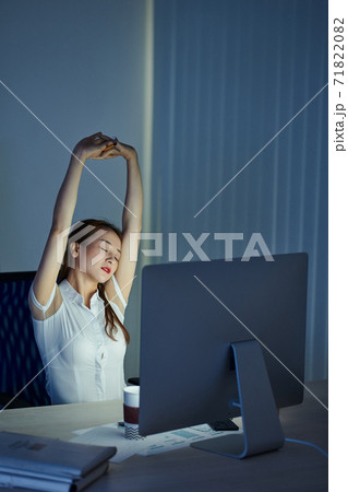 Businesswoman stretching her back Businesswoman stretching her back 71822082