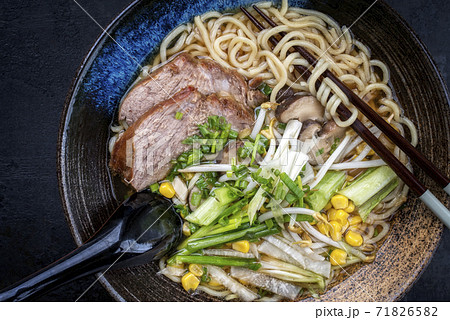 Traditional Japanese shoyu ramen soup with chashu  71826582