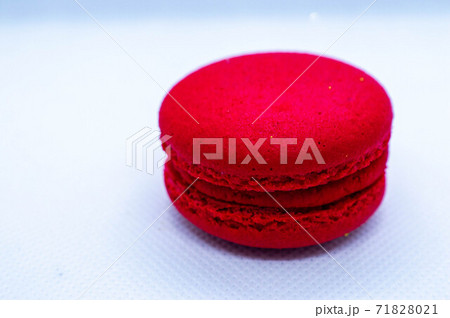 red Macaroni cookie French on white plate.Close up. Isolated 71828021