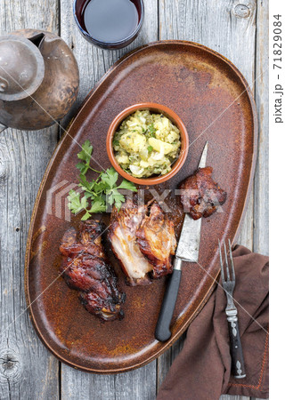 Traditional Bavarian pork knuckle with potato salad  71829084