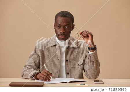 Businessman working at his workplace Businessman working at his workplace 71829542