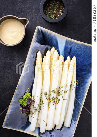 Traditional boiled white asparagus with sauce hollandaise  71833267