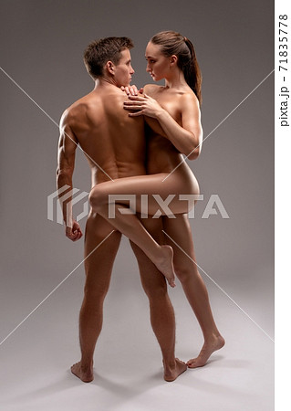 Passionate nude sexy young couple in studio 71835778
