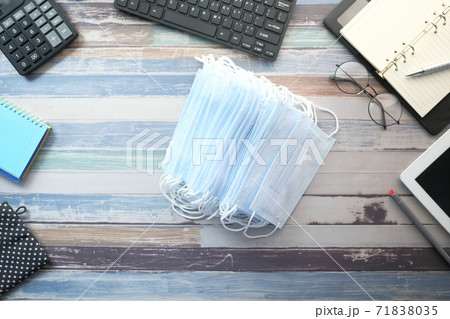 Close up of blue surgical masks on office deks  71838035