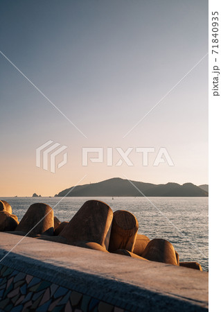 Haeundae seascape with breakwater at sunset in Busan, Korea 71840935