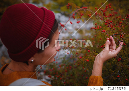 Outdoor fashion photo of young beautiful lady surrounded autumn forest in mountains 71845376