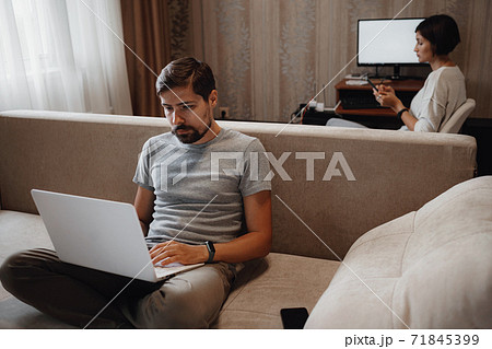 Couple Working And Playing With Laptop Computer At Home Couple Working And Playing With Laptop Computer At Home 71845399
