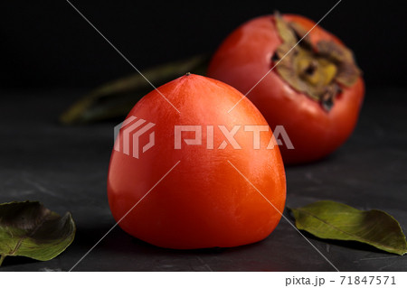 Kaki fruit. Persimmon. Sweet fuyu. Ripe diospirus 71847571