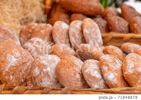 Rustic freshly baked bread ciabatta at a food fair (Selective focus) Rustic freshly baked bread ciabatta at a food fair (Selective focus) 71848878