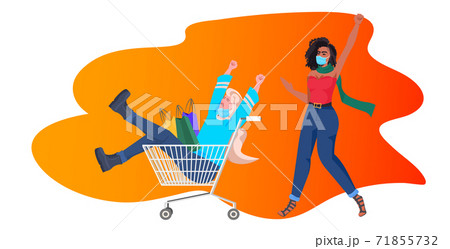 mix race girls with shopping bags having fun black friday big sale coronavirus quarantine concept 71855732