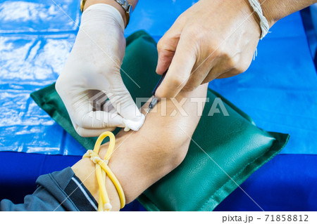 doctor injection needle on arm to collect blood for test the health selective focus syringe 71858812