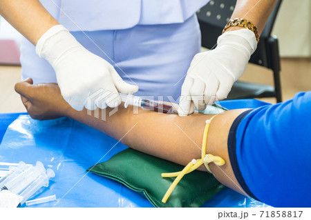 doctor injection needle on arm to collect blood for test the health selective focus syringe 71858817