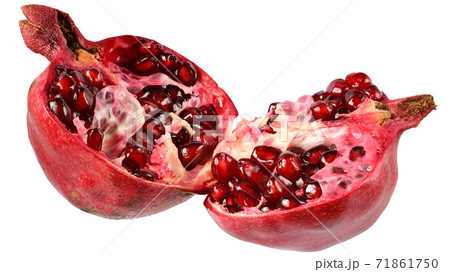 Cut the pomegranate with scattered grain isolated Cut the pomegranate with scattered grain isolated 71861750