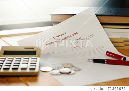 school scholarship application form on wooden table school scholarship application form on wooden table 71863073