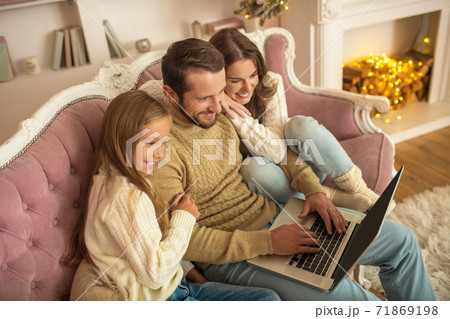 Young family spending holdiday togather and looking happy Young family spending holdiday togather and looking happy 71869198