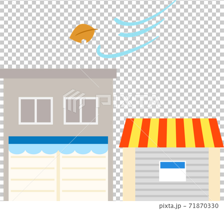 シャッターを下ろした店と木枯らし 71870330